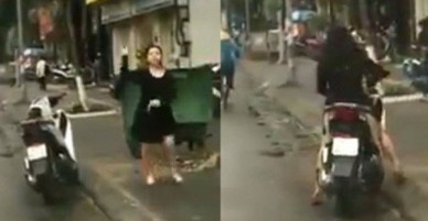 Clip xôn xao: Người phụ nữ chửi bới, cầm gạch tương thẳng kính chắn gió ô tô vì tiếng còi xe